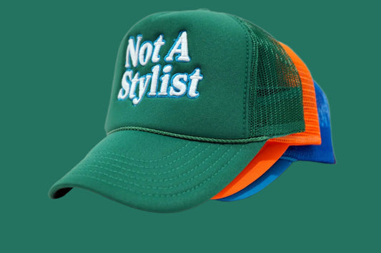 “Not A Stylist” Trucker Hat – Multi-Color Collection